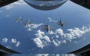 KADENA AIR BASE, Japan - U.S. Air Force F-16 Fighting Falcons fly into a four-ship formation