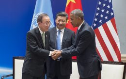 UN Secretary-General Ban Ki-moon (left) shakes hands with Barack Obama during a ceremony for the deposit of instruments by China and the United States to join the Paris Agreement. Xi Jinping looks on.