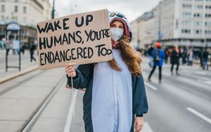 Demonstrator holding a sign at a climate protest